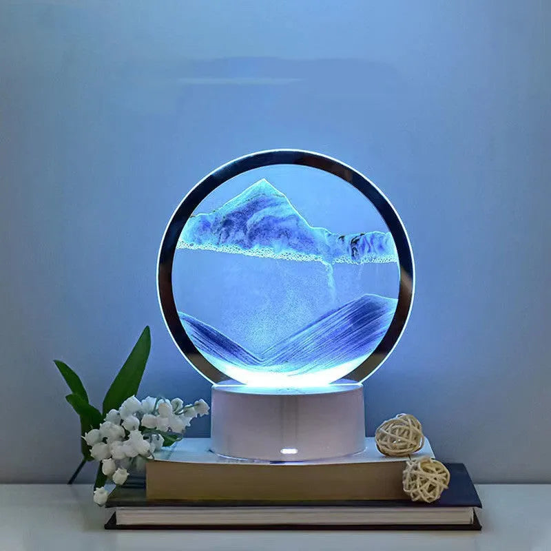 Creative 3D quicksand table lamp with glass shade and touch USB plug-in on a bedside table