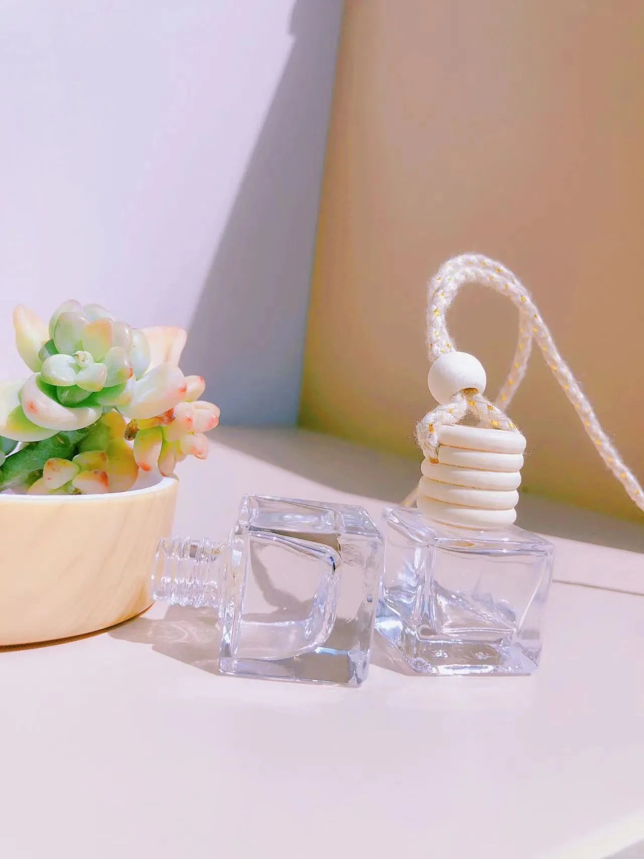 Glass car perfume pendant fragrance showing cylinder, diamond, flat drum and square container style options
