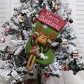 Three large Christmas stockings with Santa, Snowman and Reindeer 3D designs hanging for holiday decoration