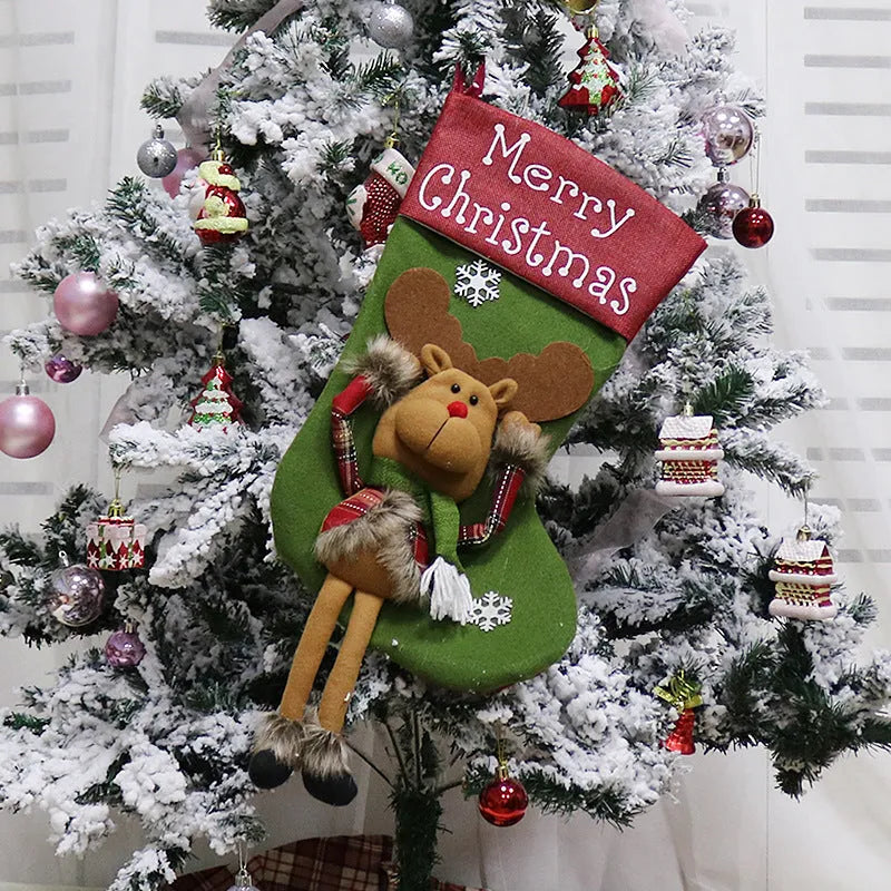 Three large Christmas stockings with Santa, Snowman and Reindeer 3D designs hanging for holiday decoration