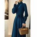 Solid colour turtleneck knitwear dress with loose big hem and elastic waist in free size, shown in black