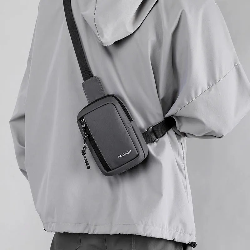 Large capacity nylon crossbody bag for men, vertical square shape, black colour, sewing line details, medium-soft structure