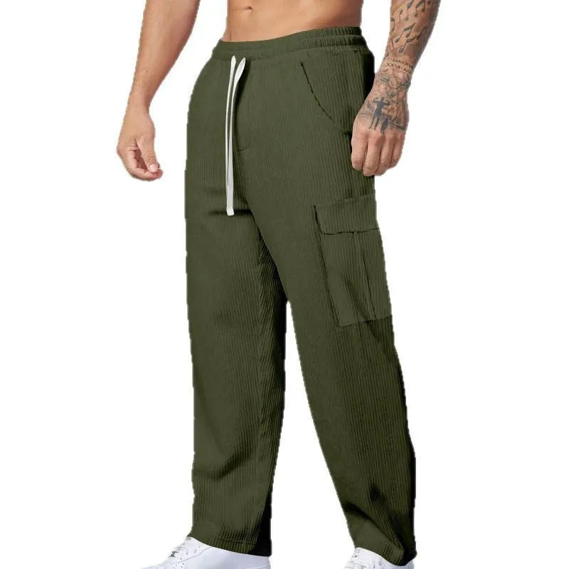Men's loose-fitting corduroy cargo trousers in a straight-leg cut, shown in a solid colour.