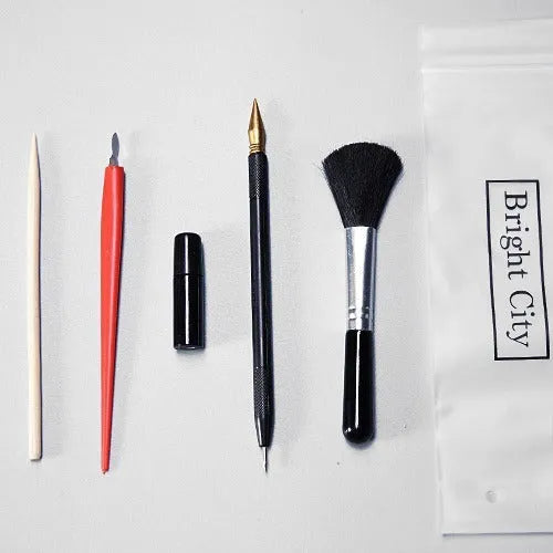 Scratch painting tools kit showing healing pen models, scrapers, brushes, and photo frames for creative art projects