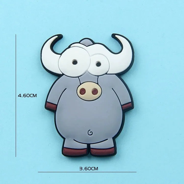 Set of 9 colourful PVC cartoon animal refrigerator stickers on a white fridge surface