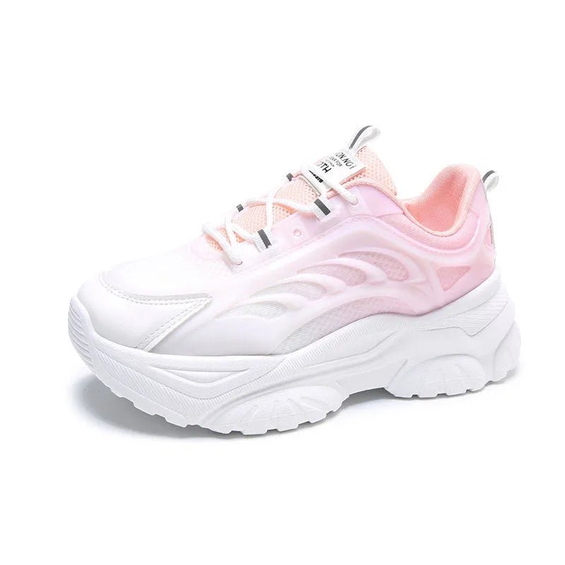 Women's blue satin casual sport shoes with round toe and white laces on a flat lay.