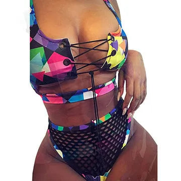 Women's multicolour checkered bikini set with cross-strap bra and high-waist fishnet briefs on a neutral background.