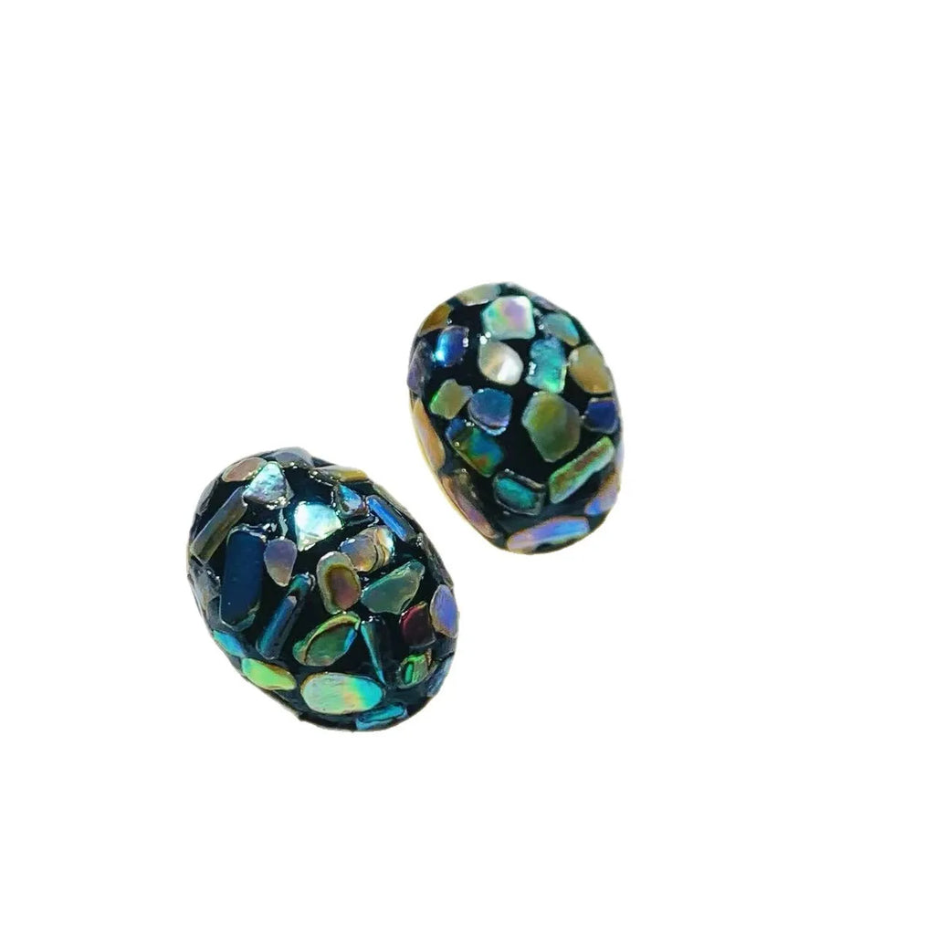 Lacquer rhinoceros skin bead and pearl stud earrings with Chinese character 'Fu' motif in geometric abstract shape, mother-of-pearl colour