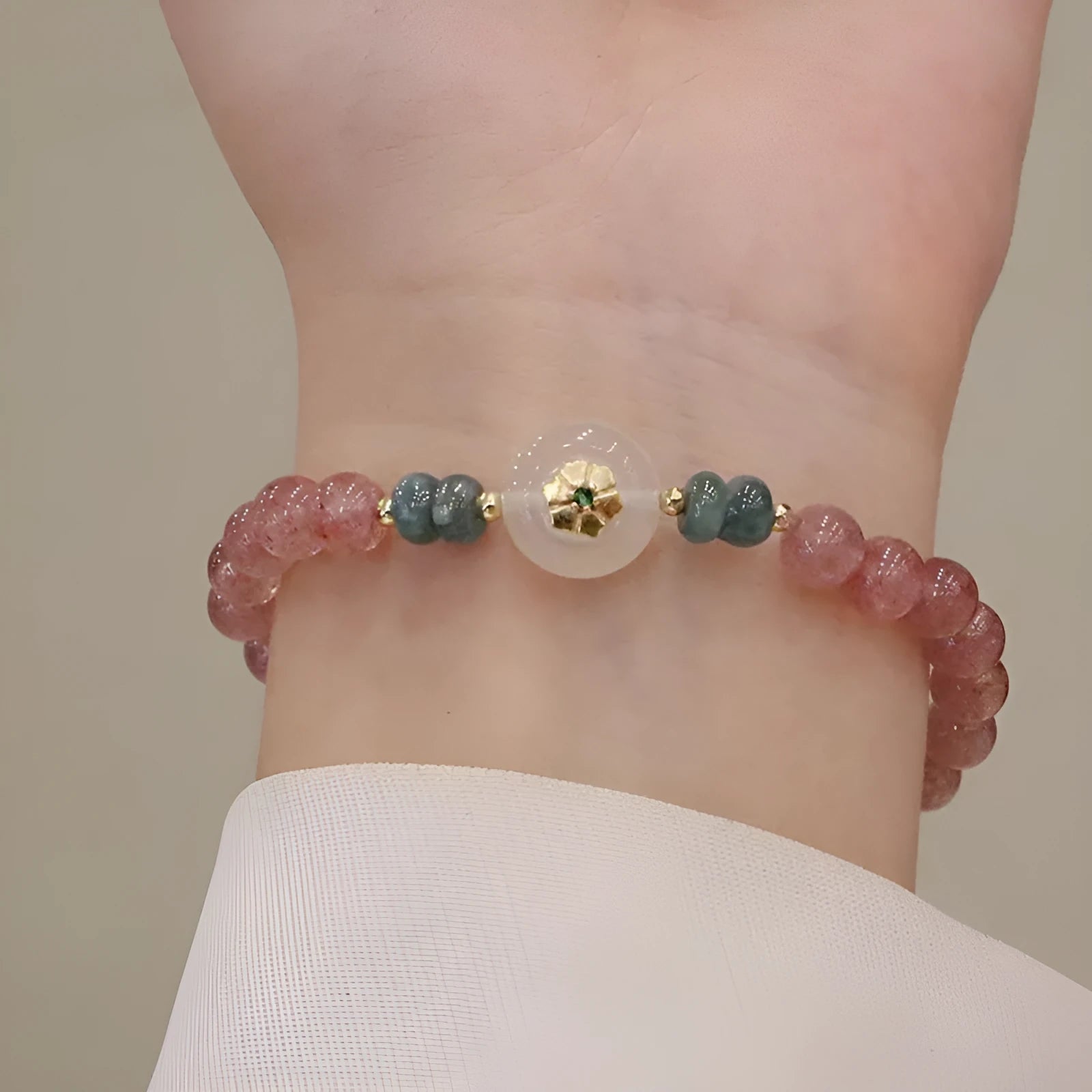 Strawberry quartz and blue water emerald bracelet with geometric diamond shapes and traditional Chinese design elements