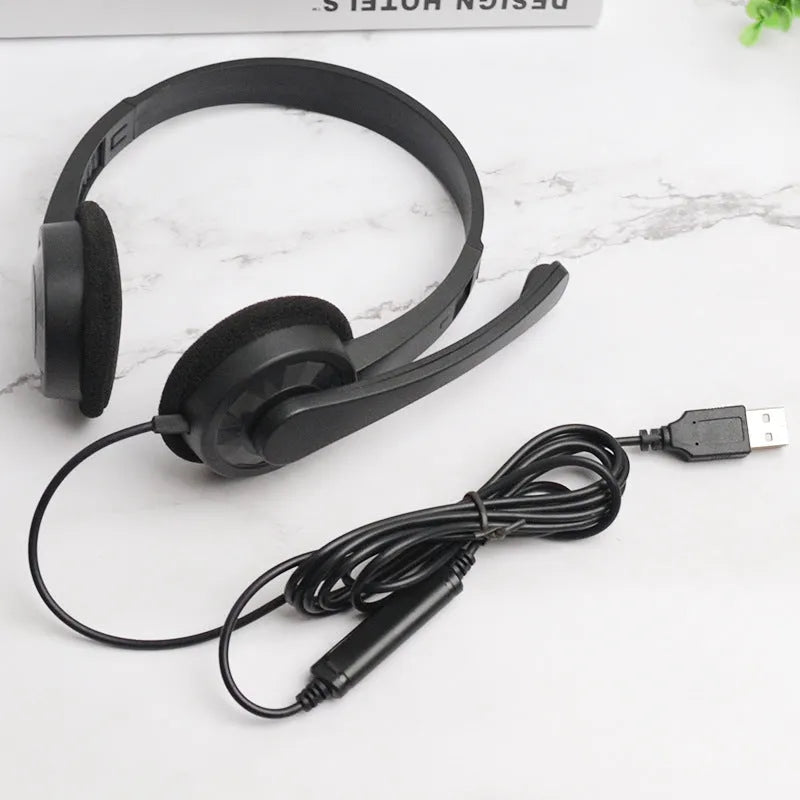 Black wired USB headset with sponge ear cushions and microphone for computer gaming and calls