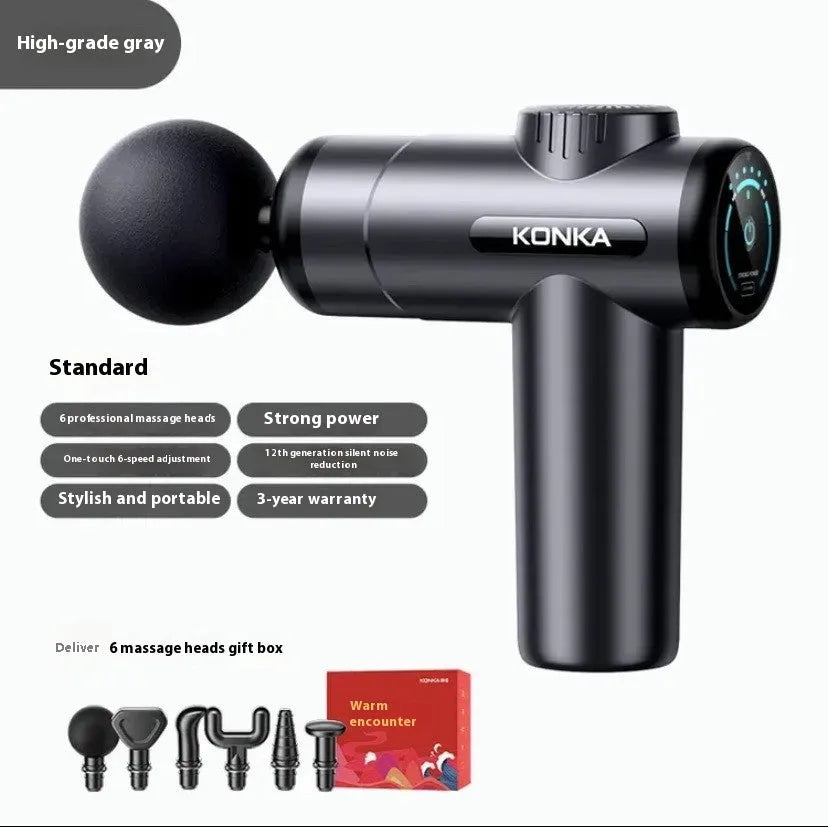 Konka professional electric mini massage gun in grey with multiple massage heads on a table