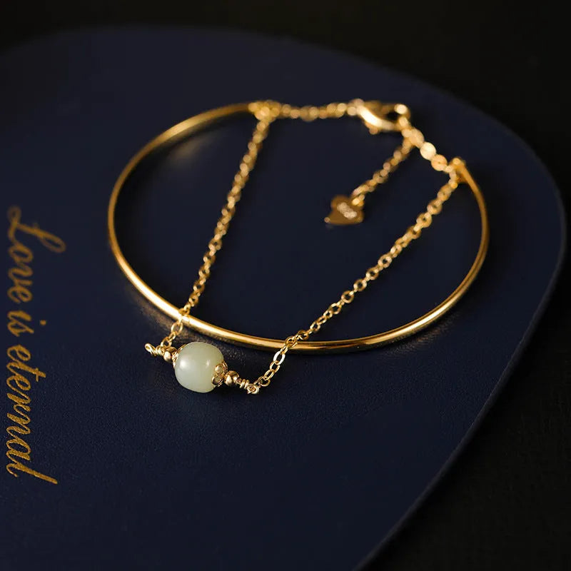 Women's jade lucky beads bracelet with gold inlay treatment in single, double, and three bead styles.