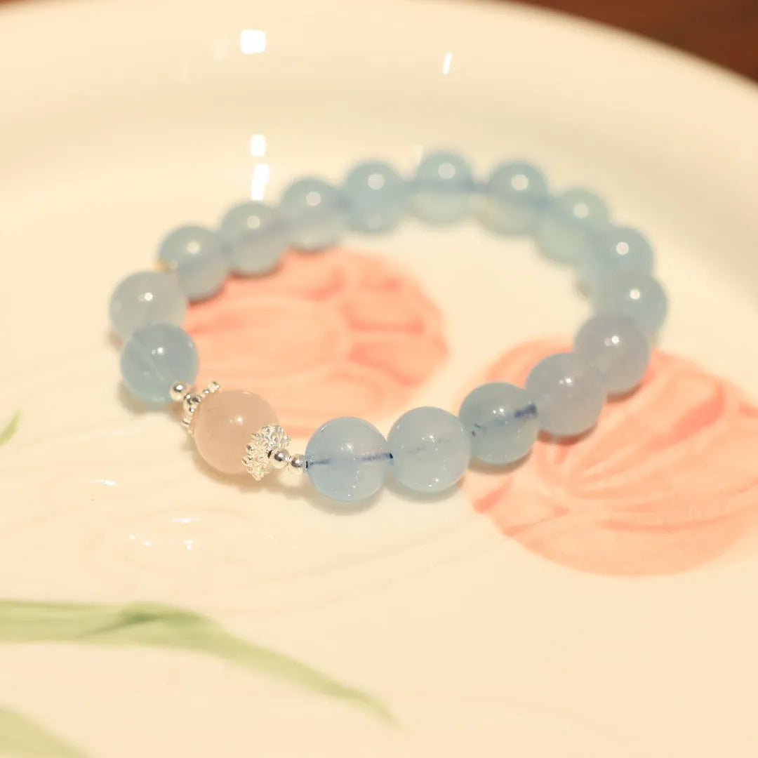 Aquamarine gemstone and components for a DIY Fengjiu Chinese style bracelet kit for women.