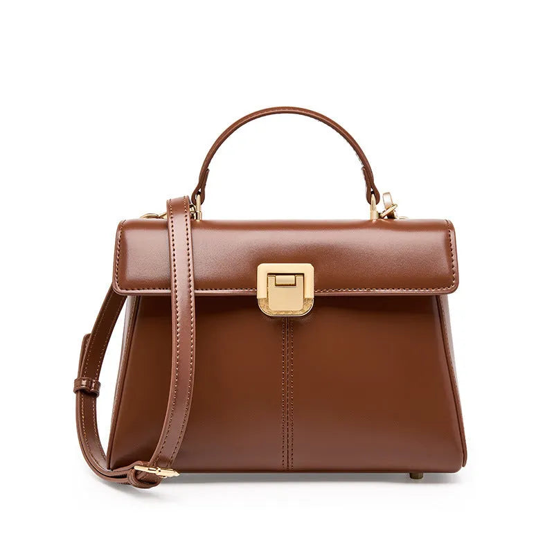 Black genuine leather women's shoulder bag with Vachette clasp closure and adjustable strap