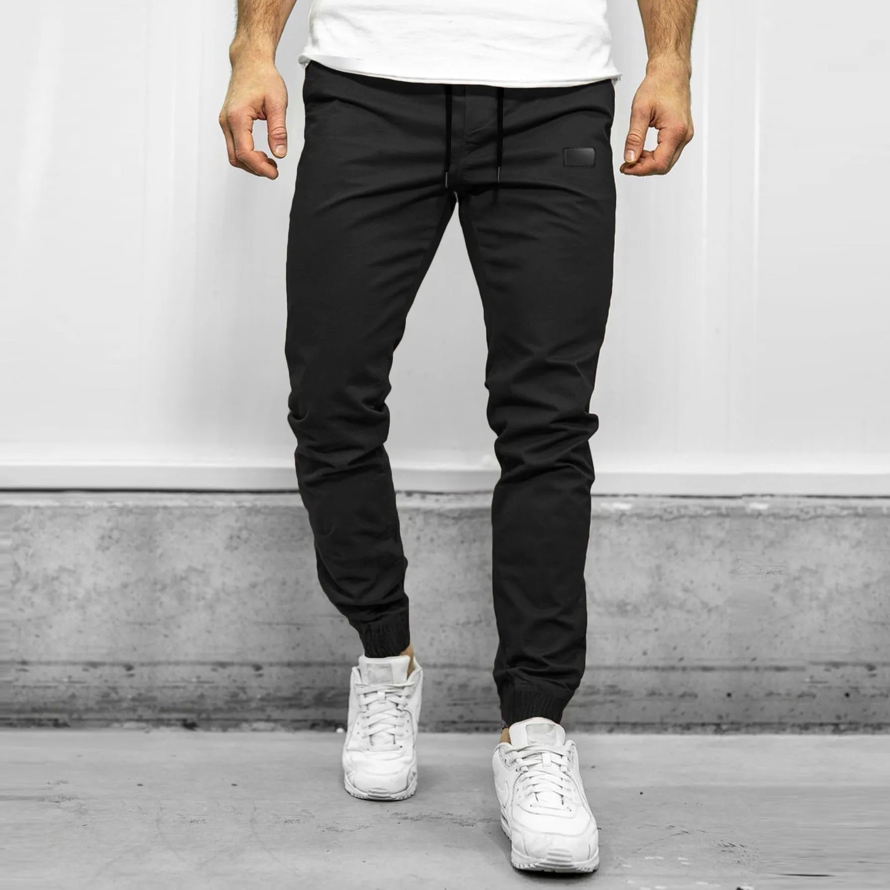 Loose fit quick-dry running trousers in polyester nylon blend, available in four colours and sizes M to XXXL