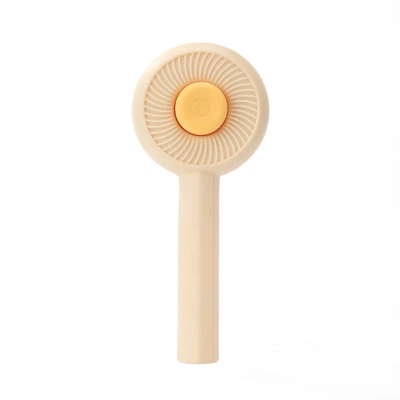 Blue pet grooming brush with angled metal needles and self-cleaning button on handle