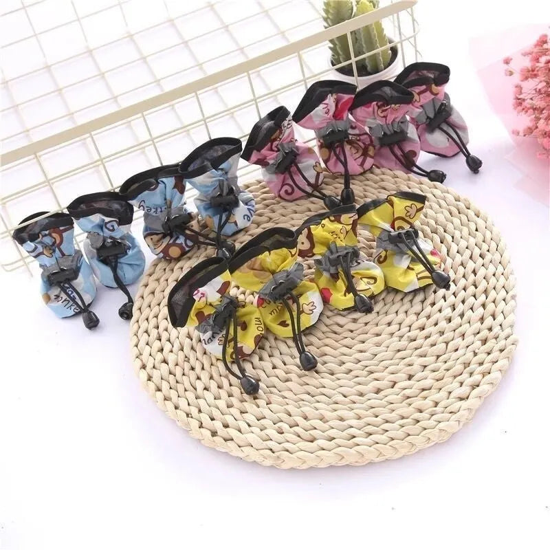 Breathable cloth dog shoes with soft soles available in multiple colours and seven size options