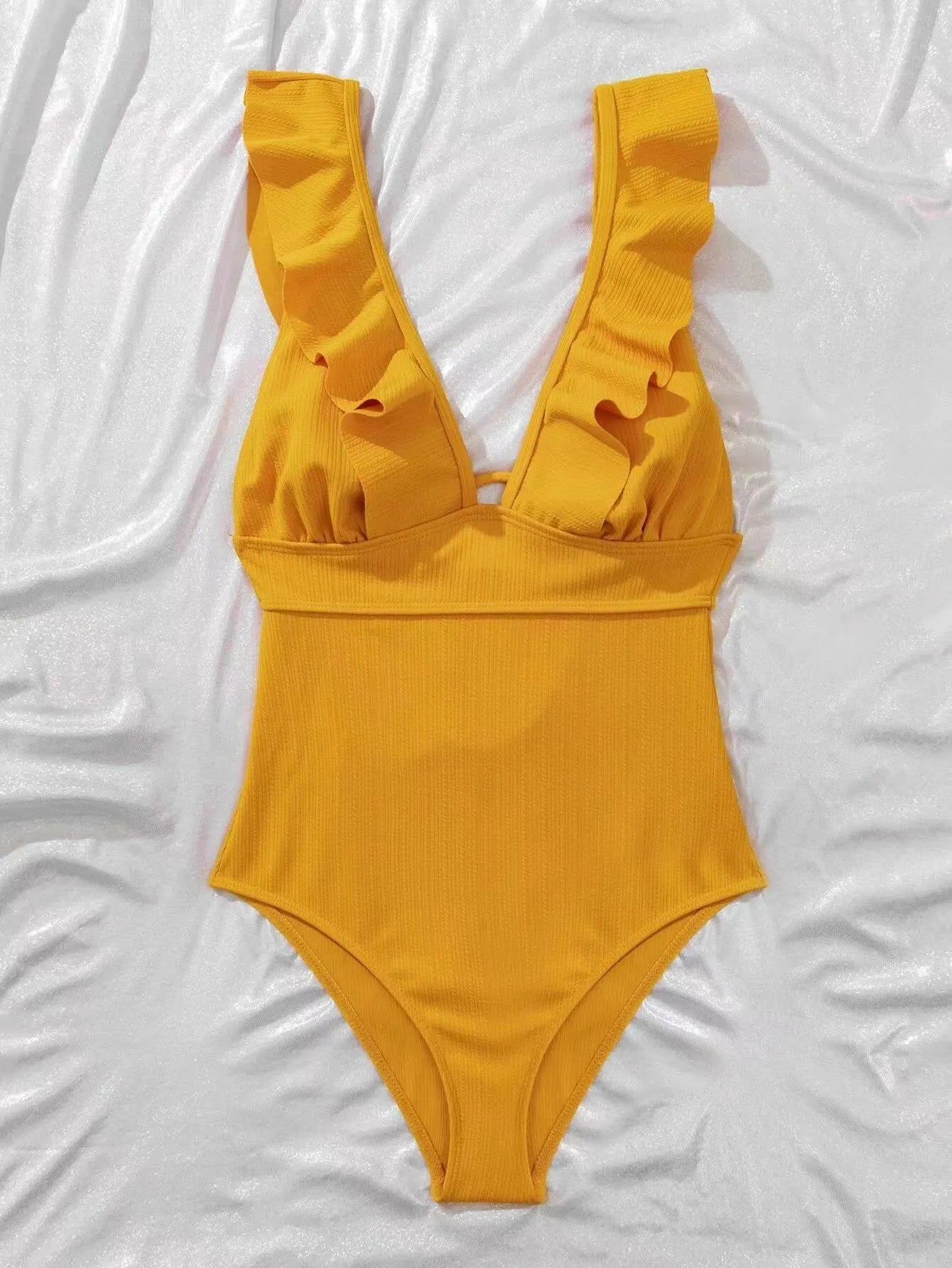 Women's black one-piece swimsuit with ruffled shoulder straps and lace-up back.