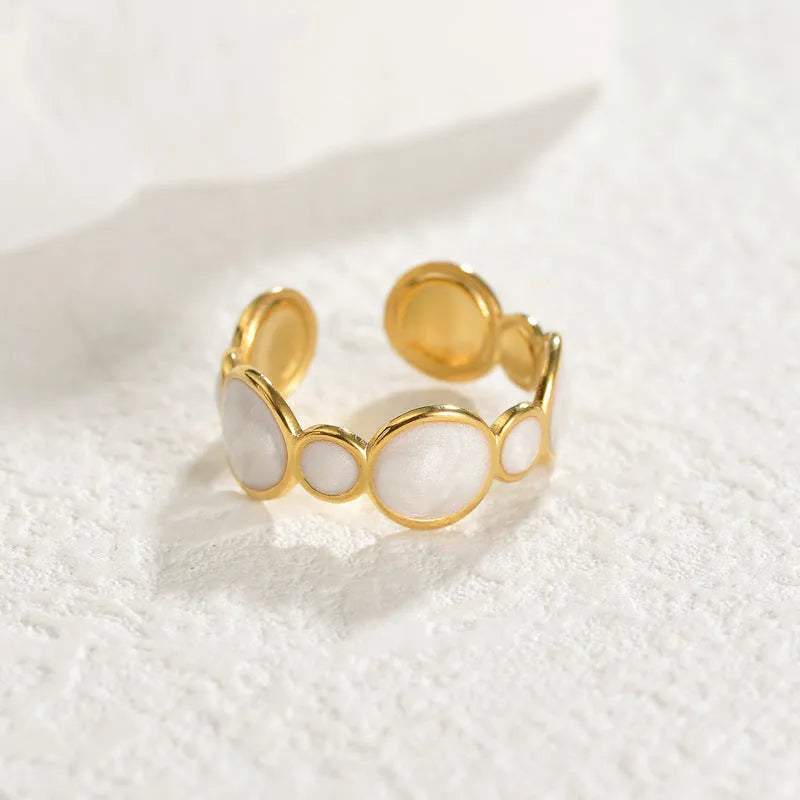 Geometric stainless steel ring with adjustable opening and electroplated metallic finish