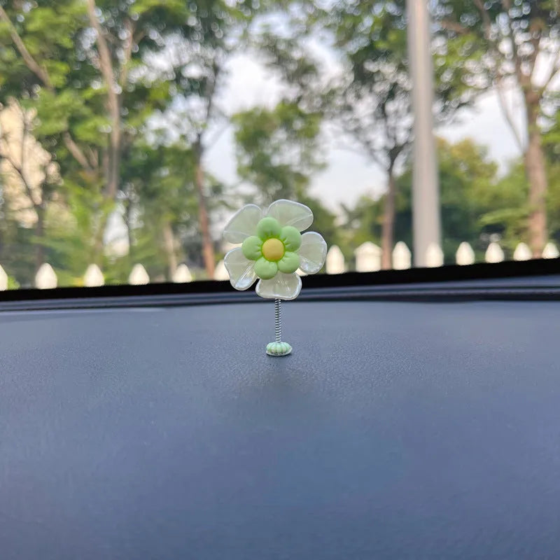 Cute plastic swing car decoration in blue, showing approximate 5cm height.