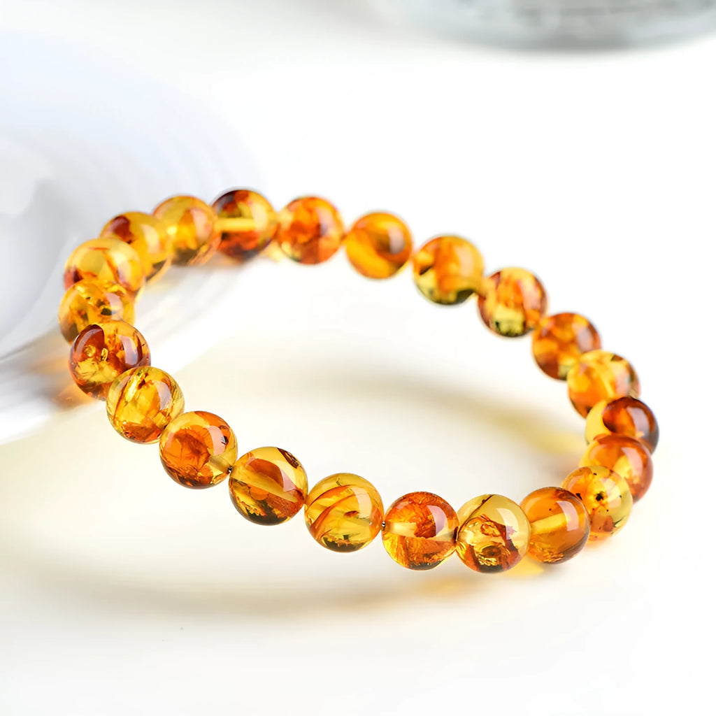 Natural yellow piebald amber bracelet with geometry beads showing flower spot patterns