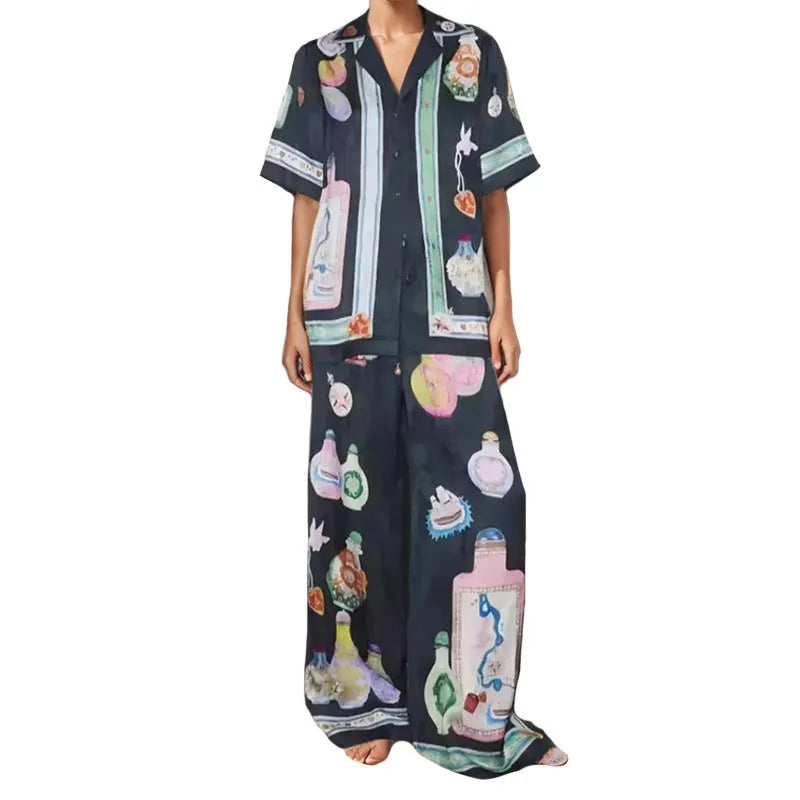 Black women's cardigan and trousers set with cartoon animation print, shown as a two-piece outfit.