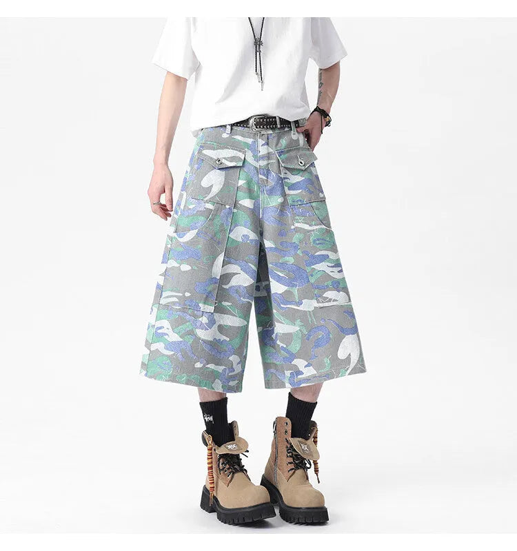 Cropped camouflage denim work trousers with straight leg cut and zipper fly closure