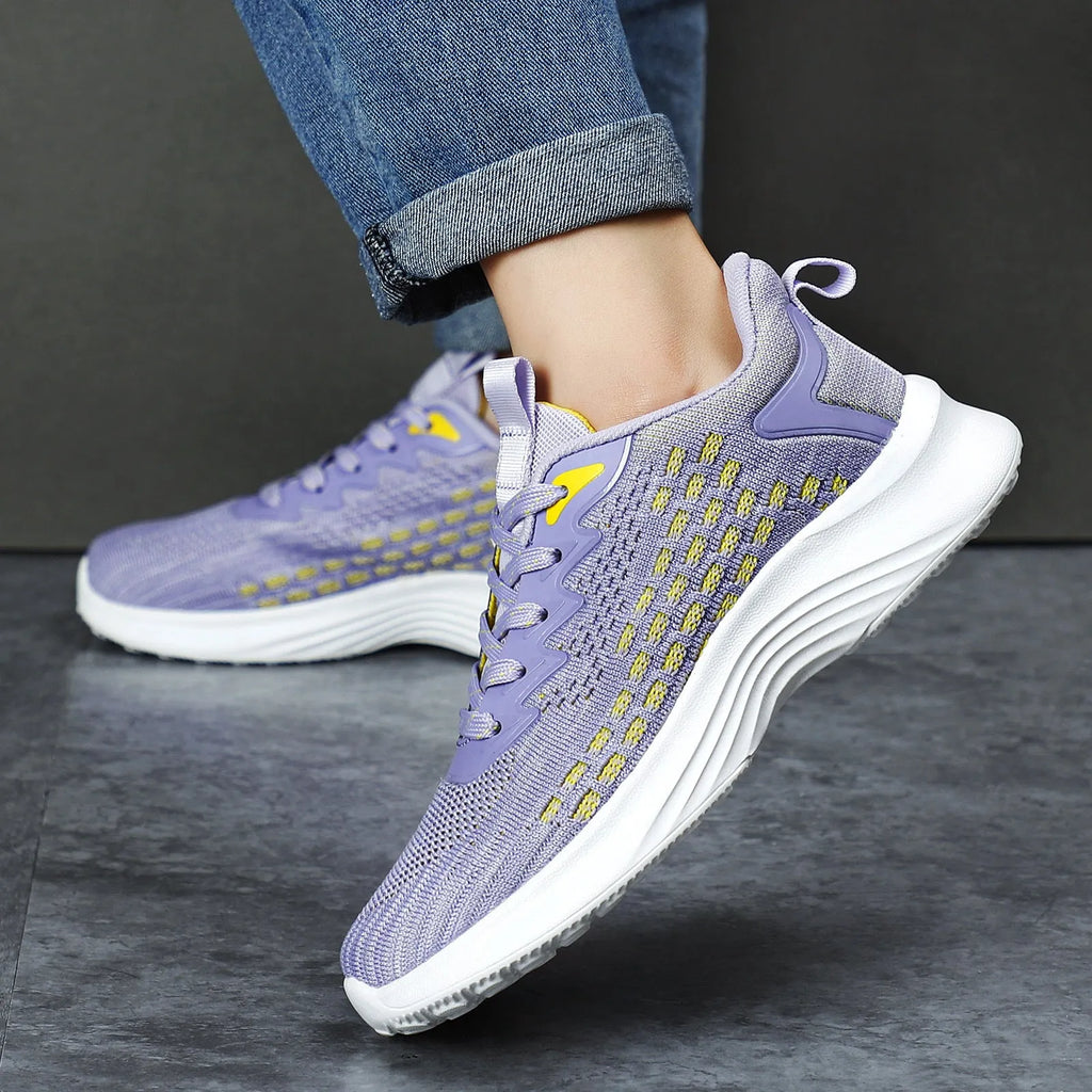 Women's lavender purple Flyknit running shoes with mesh lining and striped pattern.