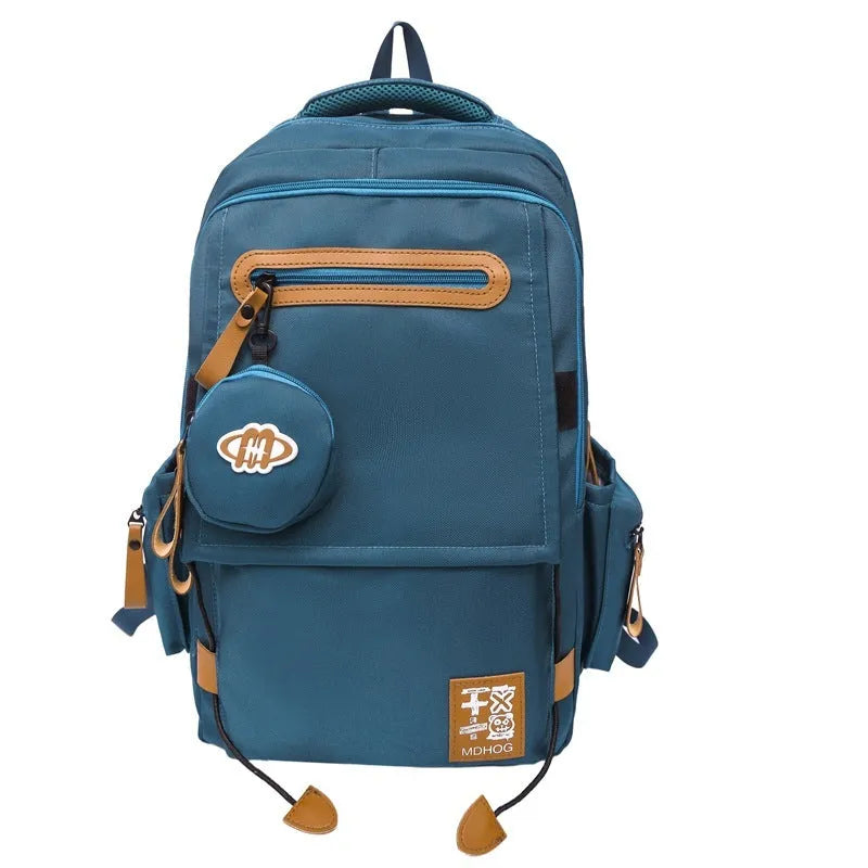 Large black waterproof nylon travel backpack with contrast stitching, shown with a 20-35L capacity.