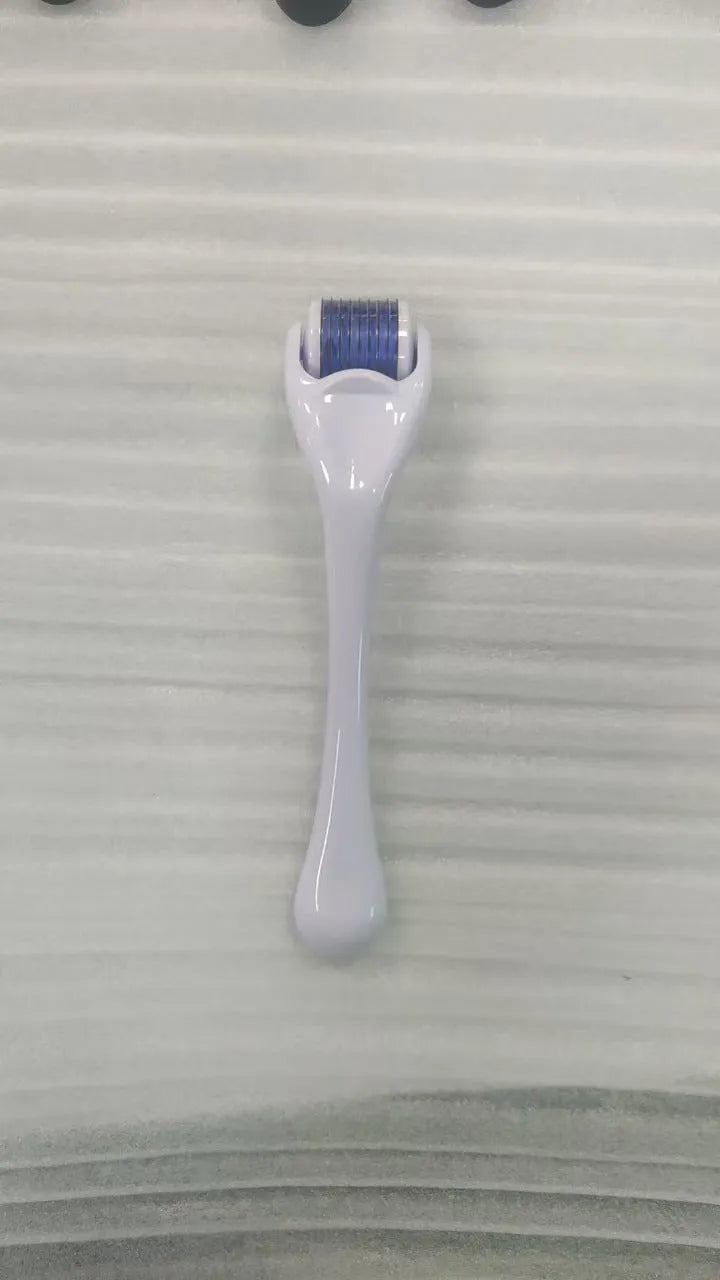 540 micro needle derma roller with black handle and purple wheel, showing adjustable needle sizes.