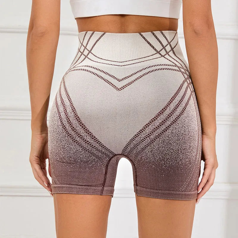 Women's high waisted gradient fitness shorts in black, shown for yoga or dance sport use.