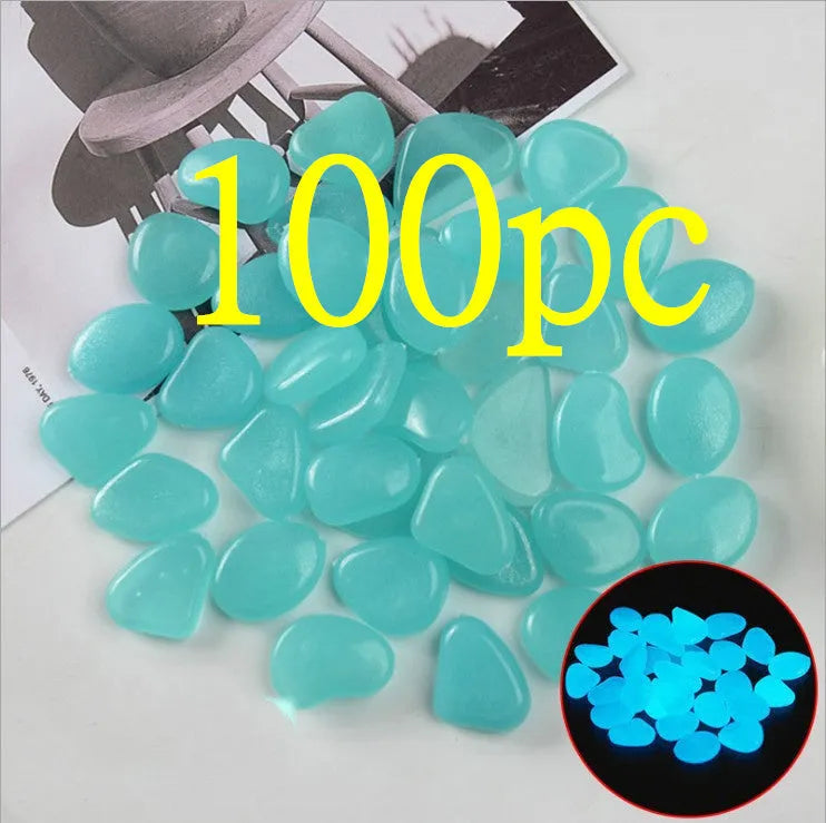Luminous fluorescent aquarium and garden pebbles in mixed colours including dark purple, yellow, light blue, pink, orange