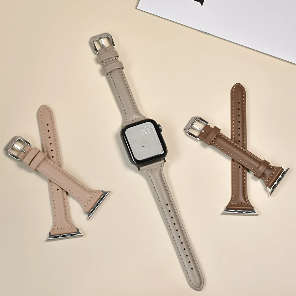 Women's retro slim leather strap for Apple Watch in cream apricot colour on a table