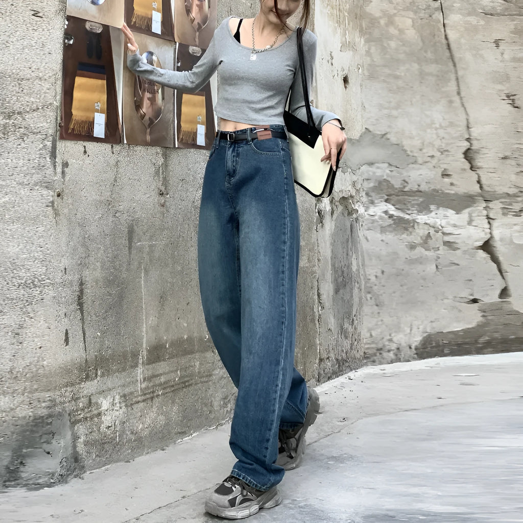 A pair of women's high waist straight leg jeans in retro blue cotton denim.