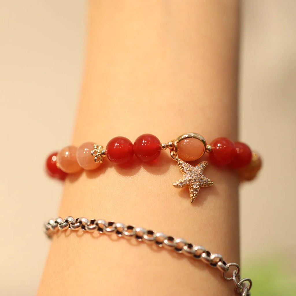 Handmade red agate and sunstone bracelet with carved xiangyun ethnic motifs, 8mm bead diameter