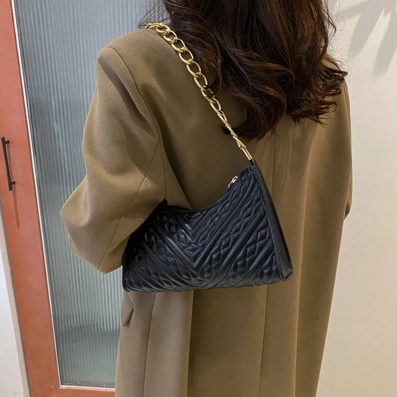 Brown PU pleated chain baguette shoulder bag showing vertical square shape and soft carry handle.