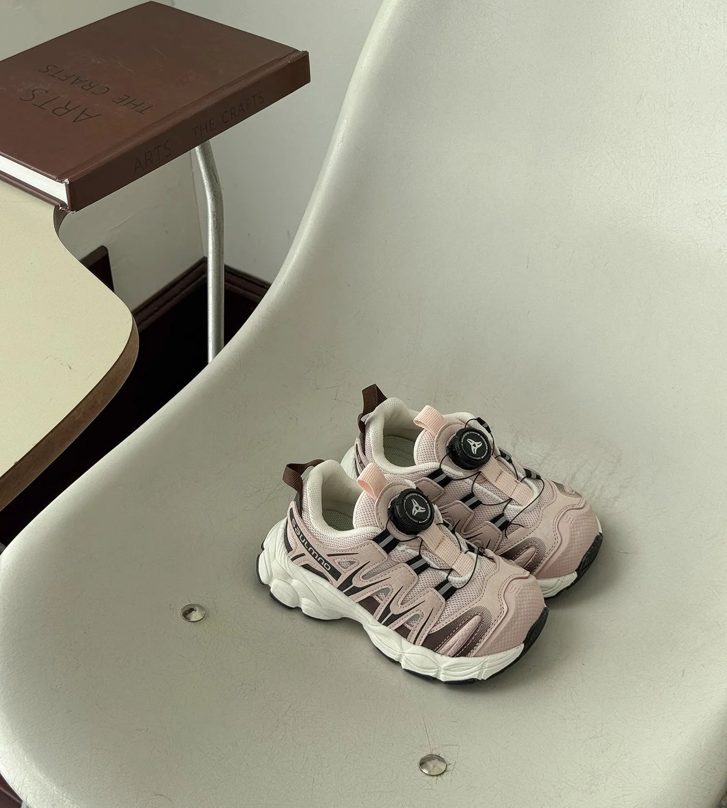 Girls solid colour casual slip-on sneakers in beige, made from lightweight PU leather mesh.