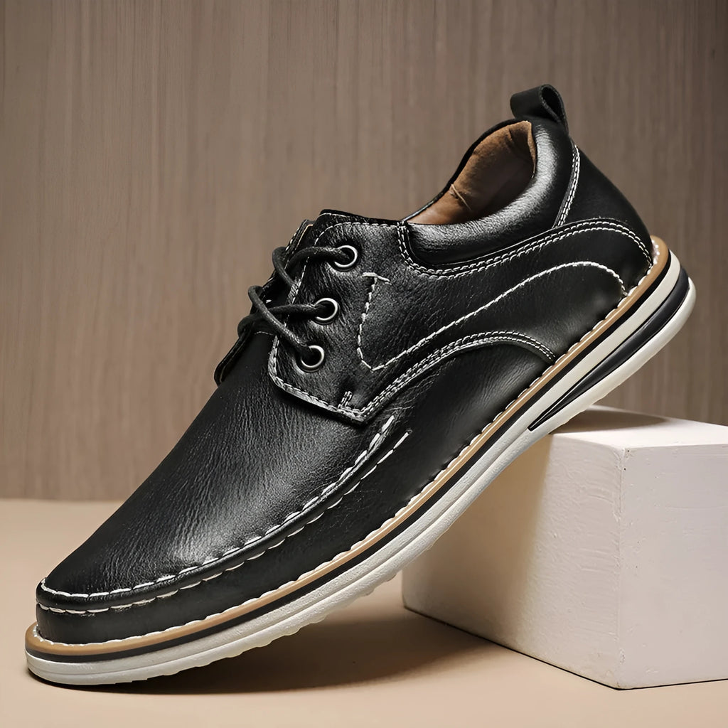 Men's black genuine leather casual lace-up shoes with round toe and rubber sole on a white background.