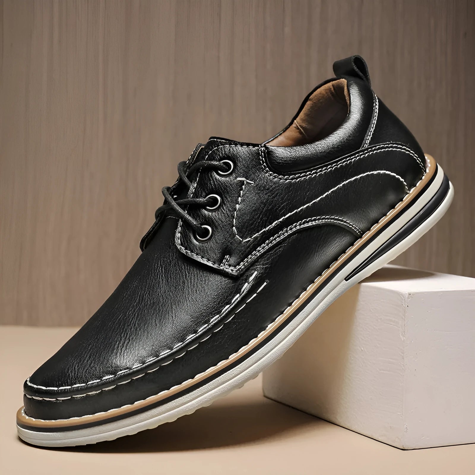 Men's black genuine leather casual lace-up shoes with round toe and rubber sole on a white background.