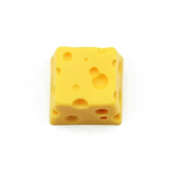 Yellow resin mechanical keyboard keycap with a detailed cheese design for MX-style switches.