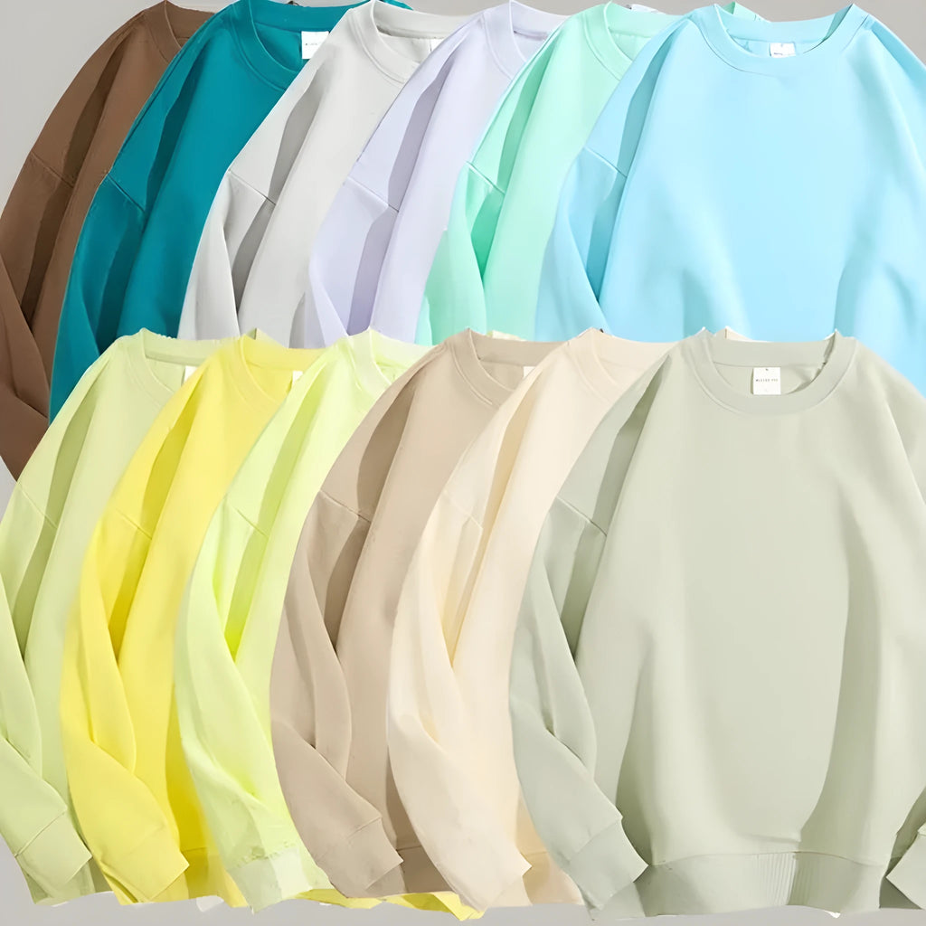 Cotton off shoulder pullover sweater in a loose fit, shown in a solid colour with long sleeves.
