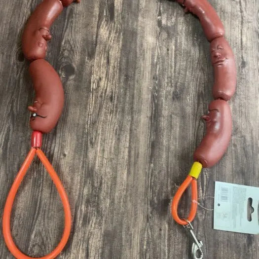 Brown nylon cat toy leash with large sausage segments and a black grip tape handle, shown at full 108cm length.