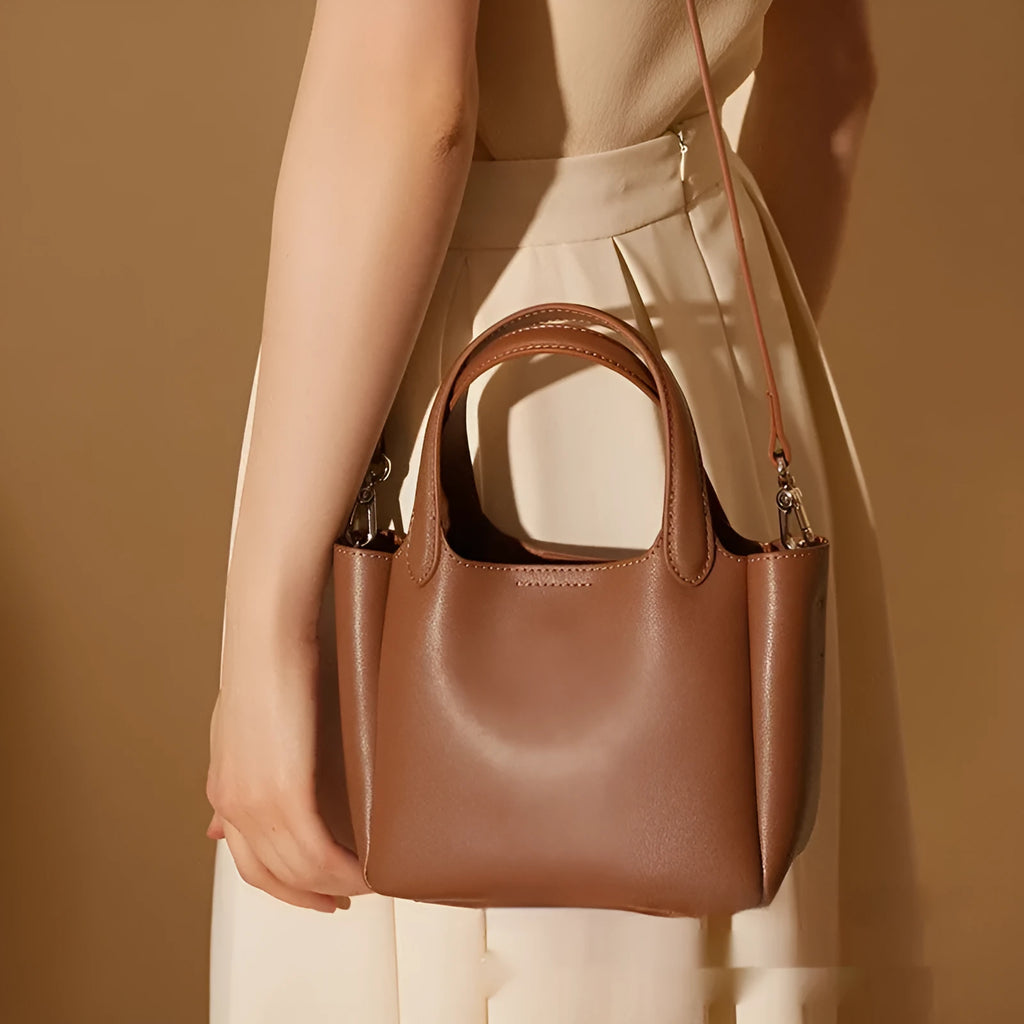 Genuine cattlehide leather cross body bucket bag in square vertical retro style.