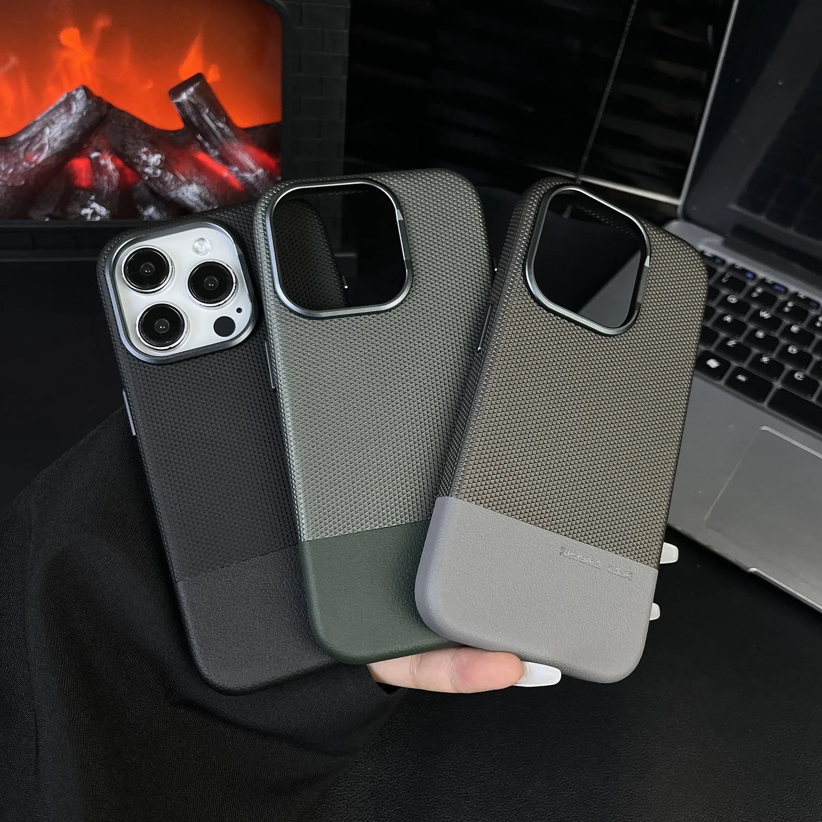 Black magnetic iPhone case with dragon scale texture and stitching, shown on an iPhone.