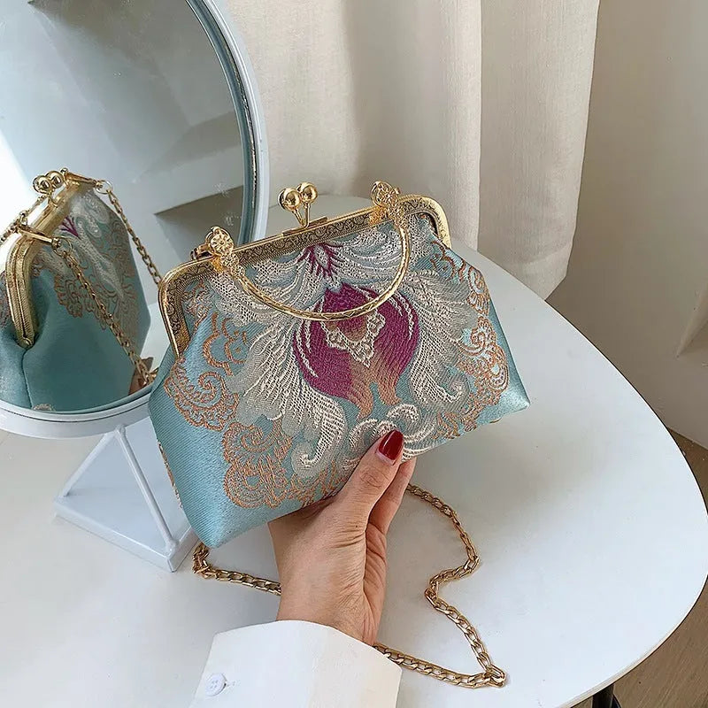 Chinese embroidery cheongsam handbag in polyester with shell shape and internal zipper compartment