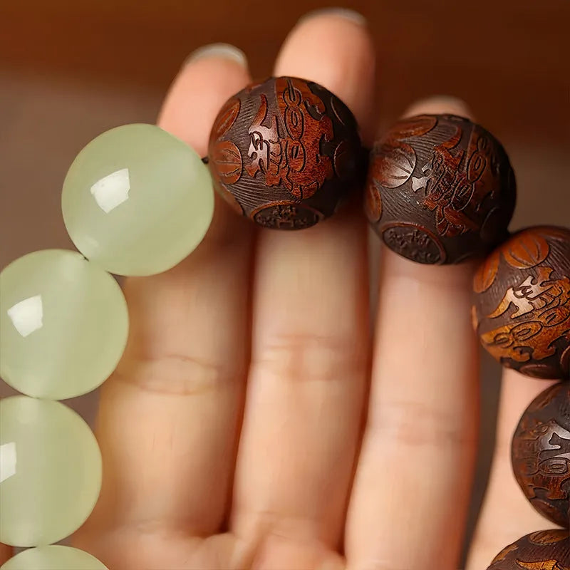 Wooden Fu character bracelet with twelve 20mm rosewood beads on flexible rings