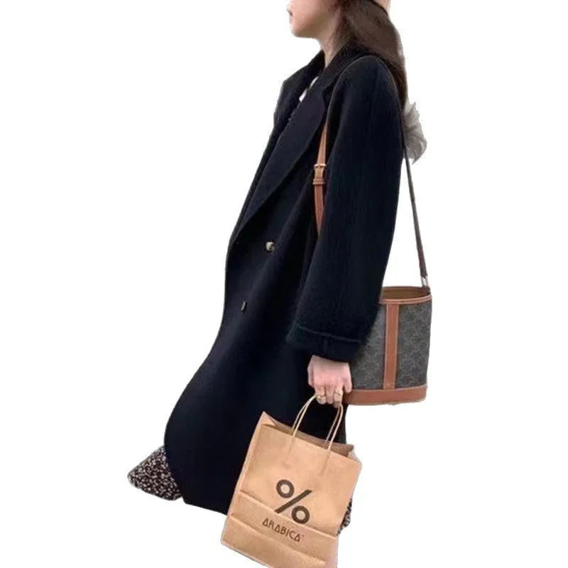 Women's high-grade woolen coat long sleeve in black colour, conventional sleeve design for casual winter wear