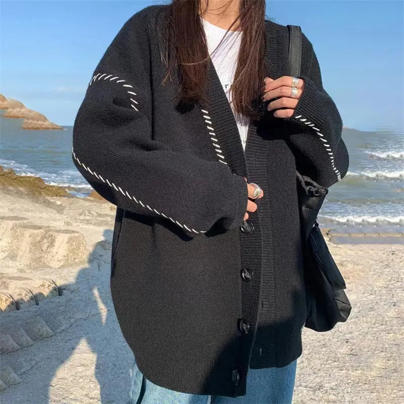 Women's loose fit black knitted cardigan with long sleeves
