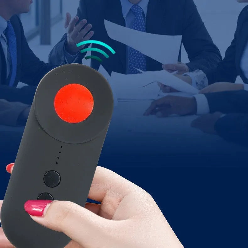 Black portable camera and GPS signal detector with USB charging port on a flat surface.