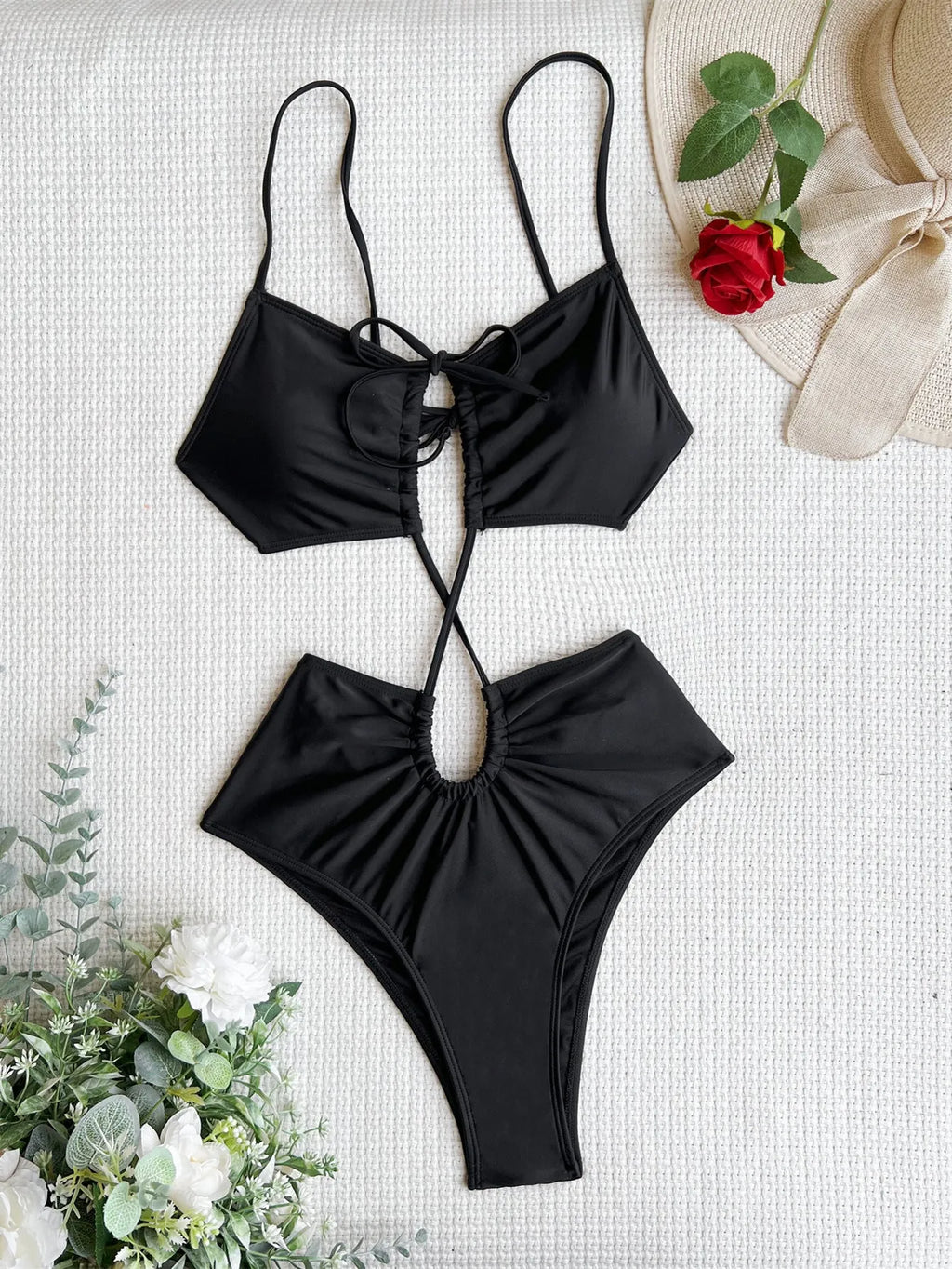 Women's sleeveless hollow one-piece swimsuit in triangle style showing green, red, and black colour options